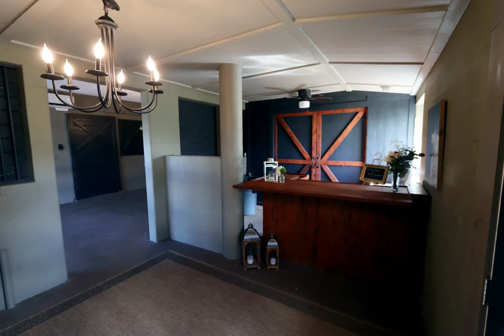 Interior bar setup inside one of the barns at Masters Stables wedding venue.