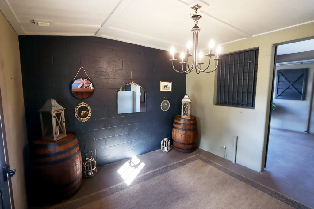 Opposite view of the bar area inside one of the barns at Masters Stables wedding venue.