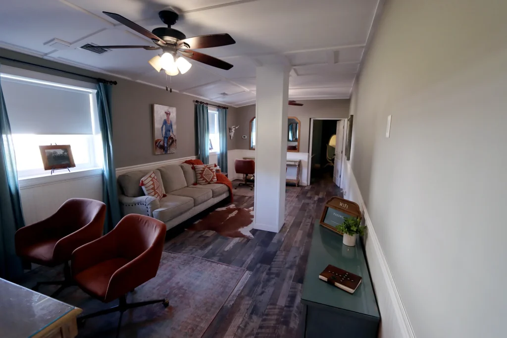 Common area living room inside the bridal suite at Masters Stables wedding venue.
