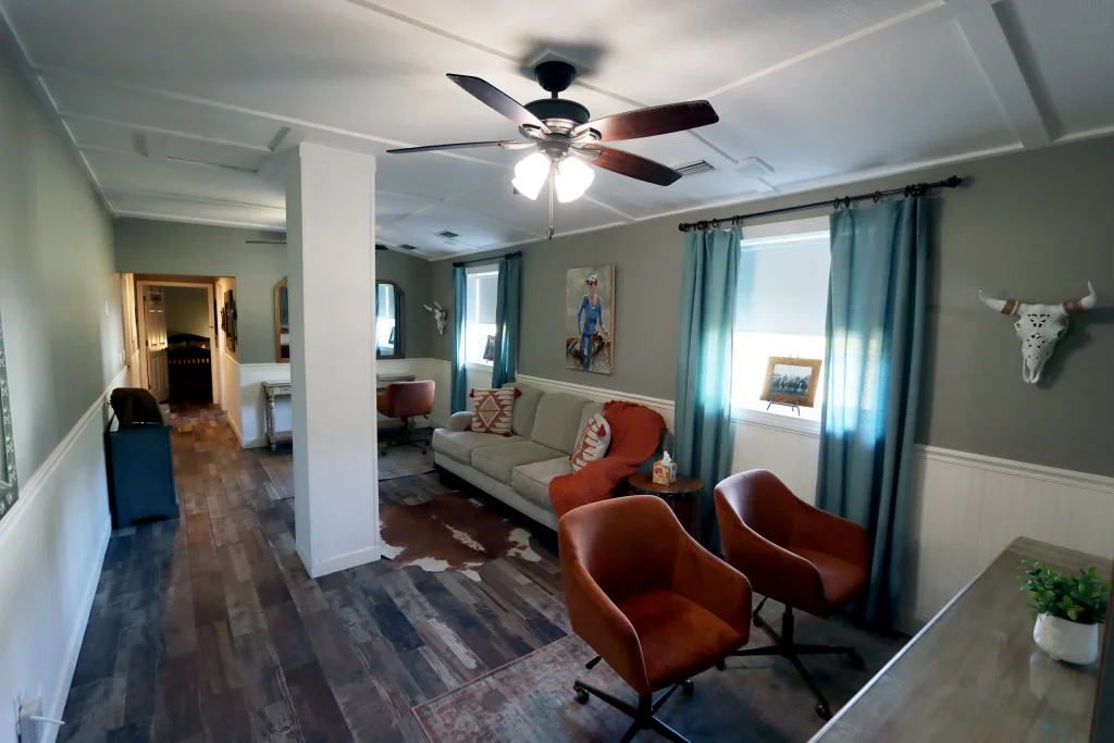 Second view of the common living area inside the bridal suite at Masters Stables wedding venue.