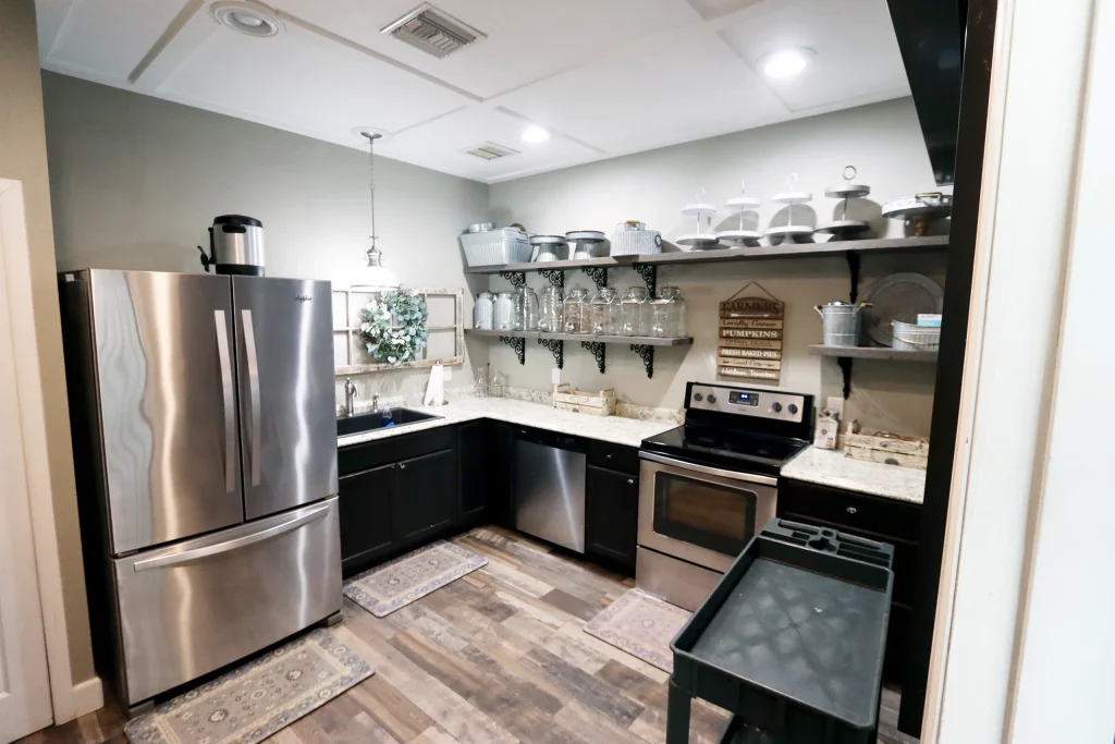 Alternate view of the catering kitchen inside the reception hall at Masters Stables wedding venue in Fellsmere, Florida.