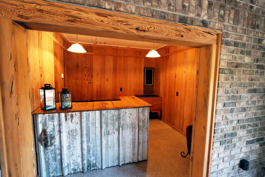 Rustic wooden bar inside the pavilion reception hall at Masters Stables wedding venue in Fellsmere, Florida.